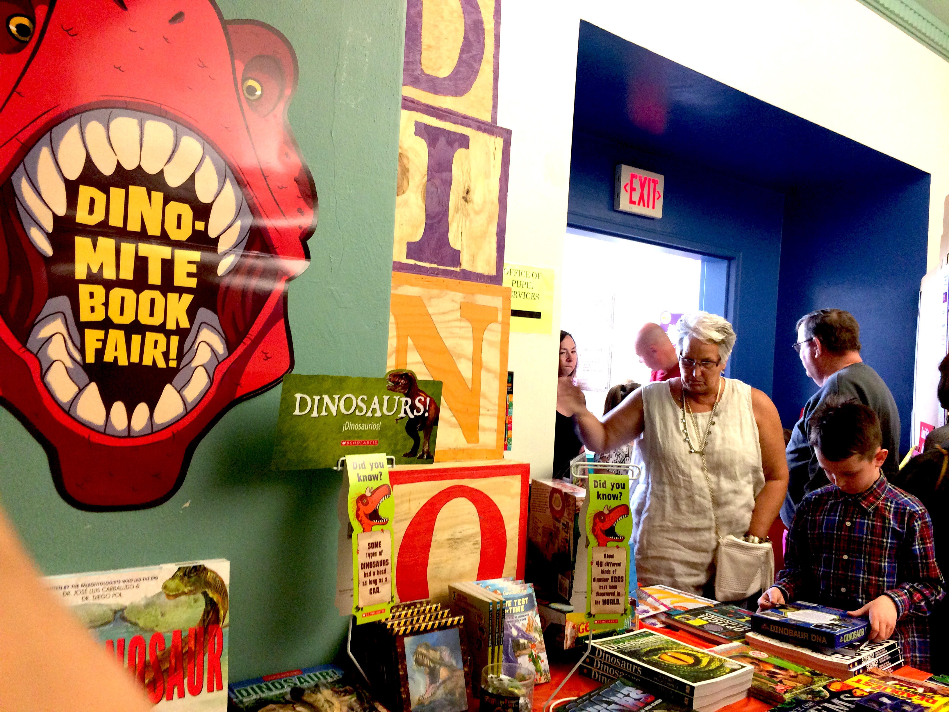 students show guests the book fair