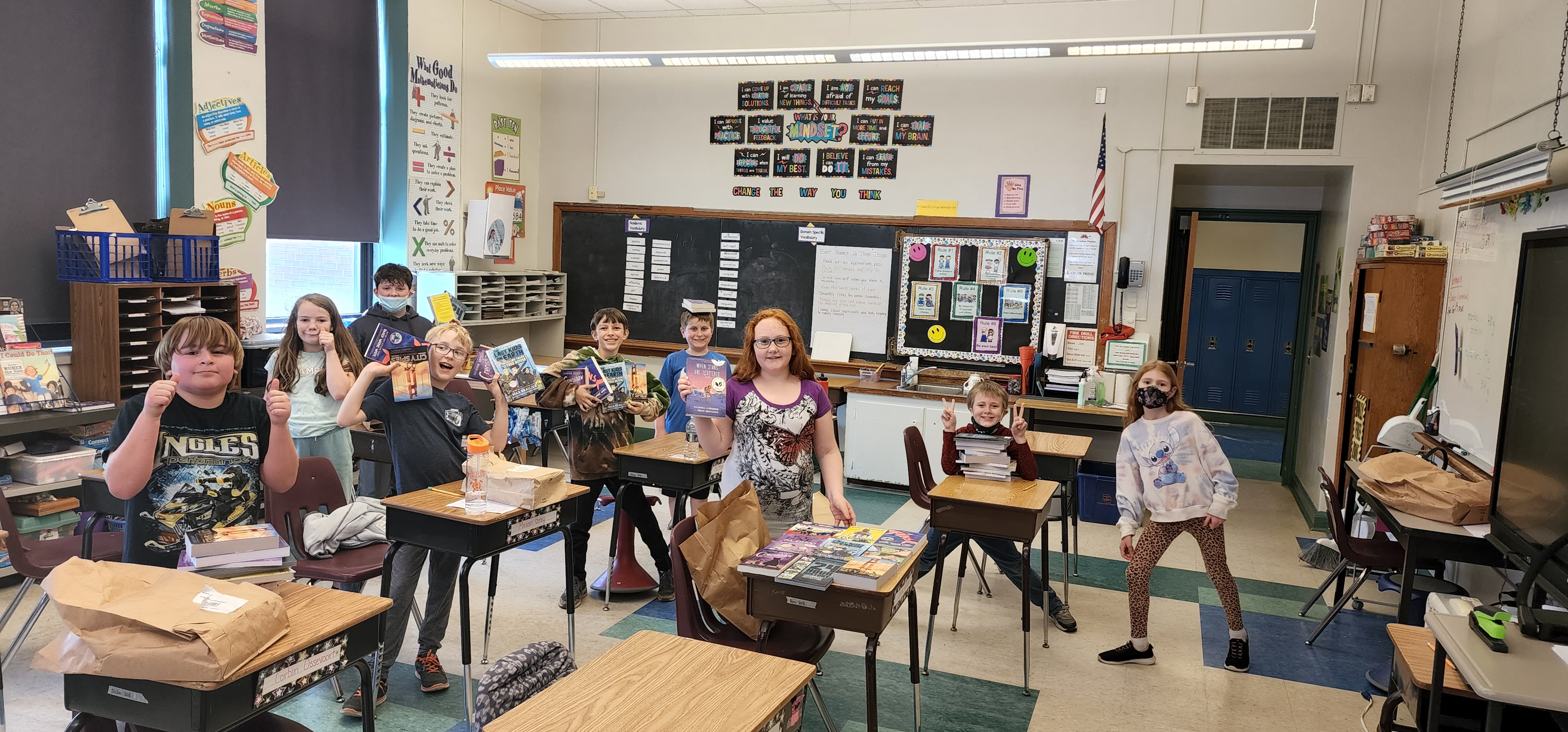 kids showing off books