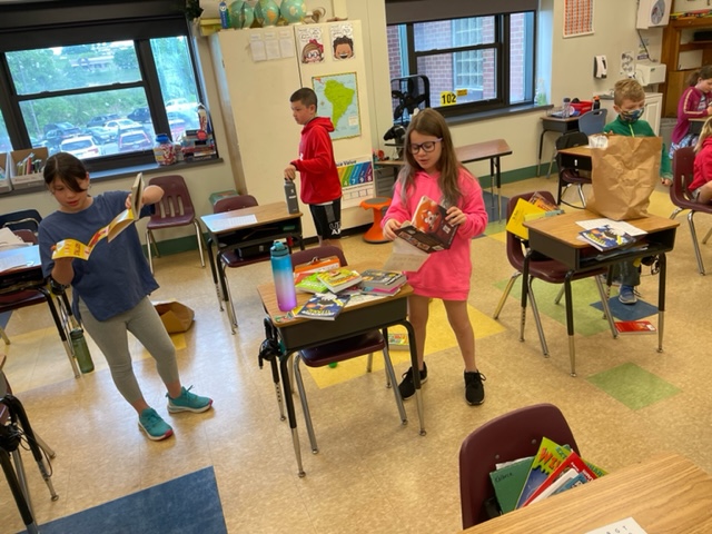 students perusing new books