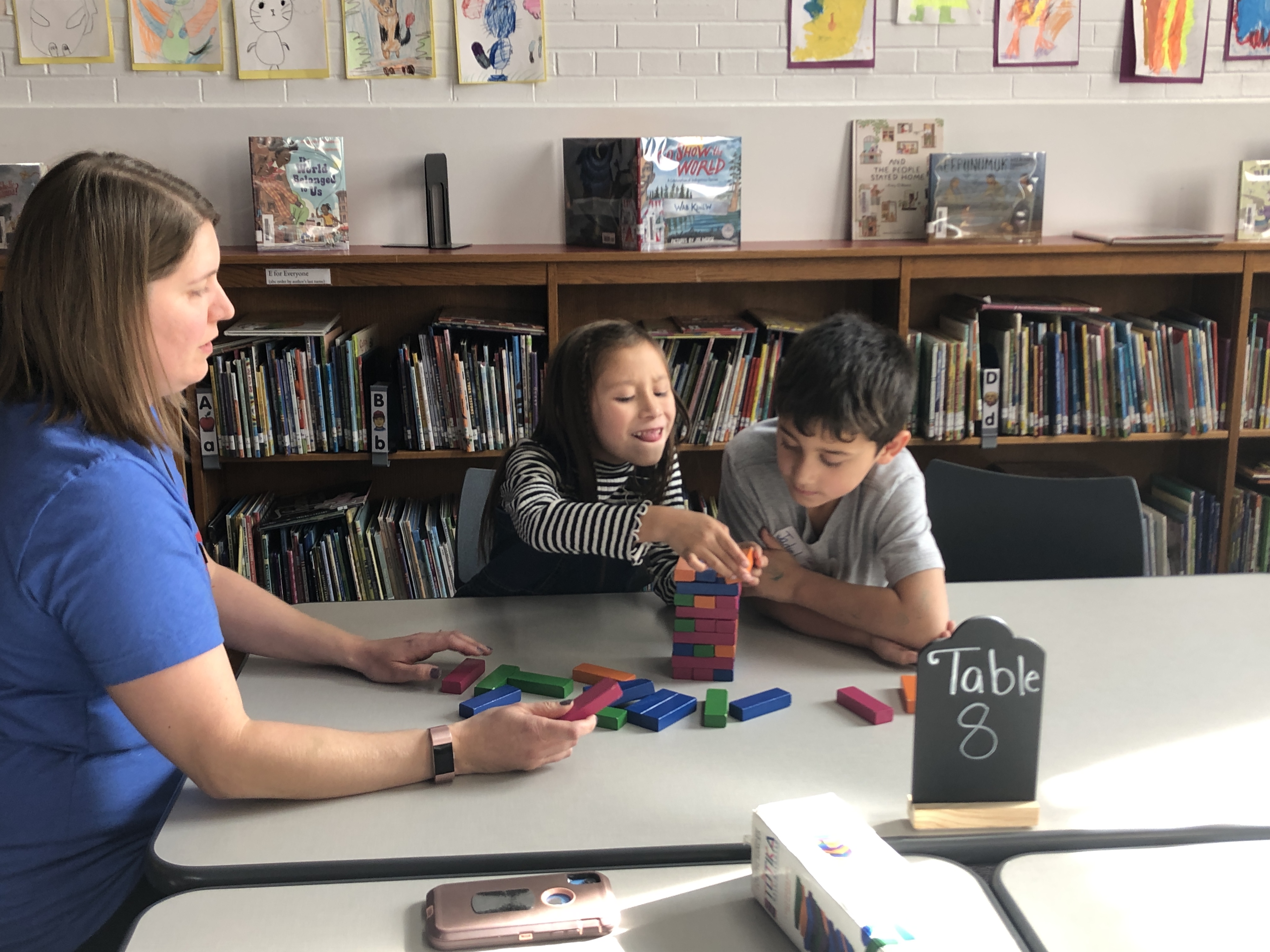 students work on making block tower