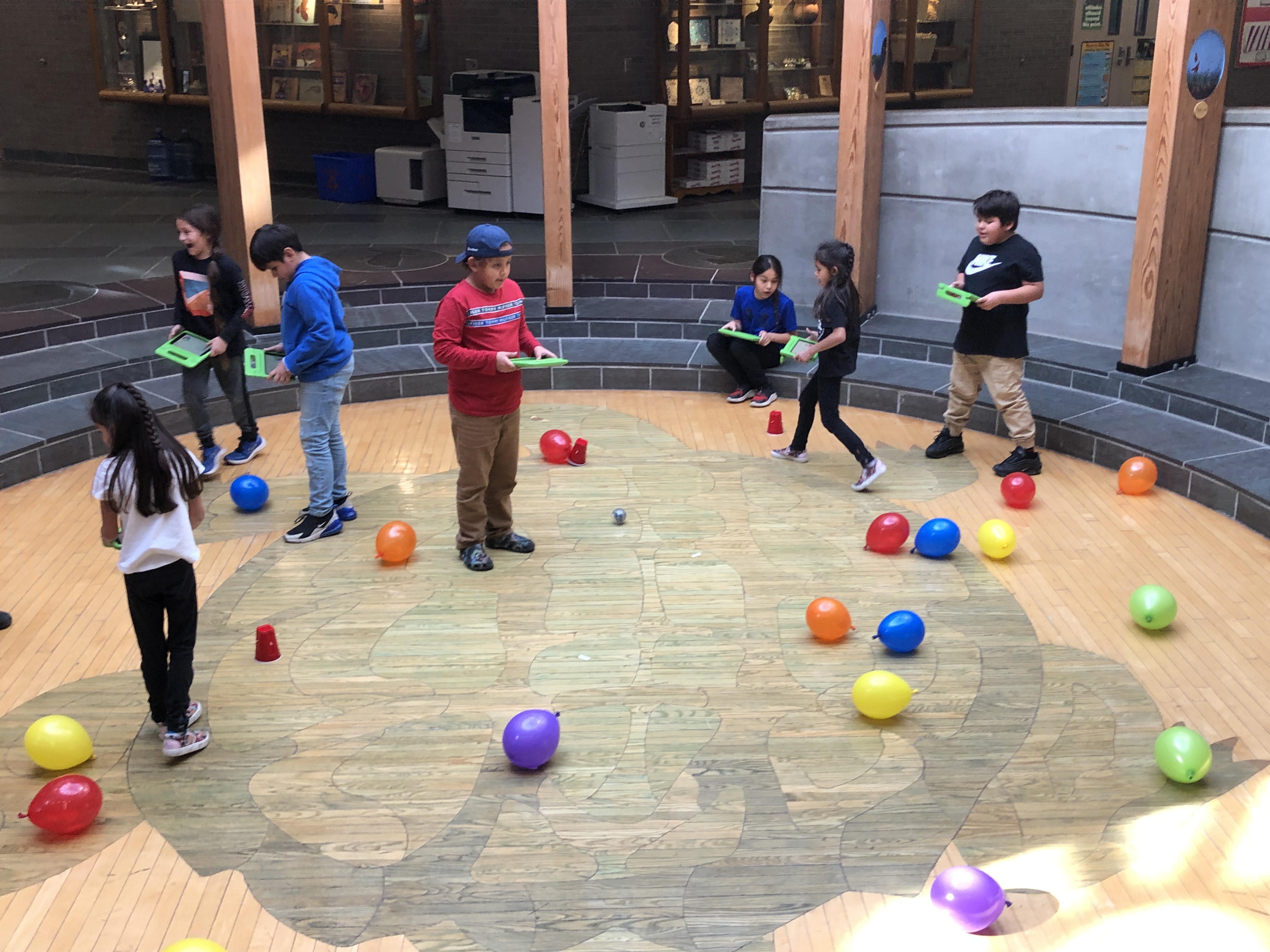 students engaged in balloon game