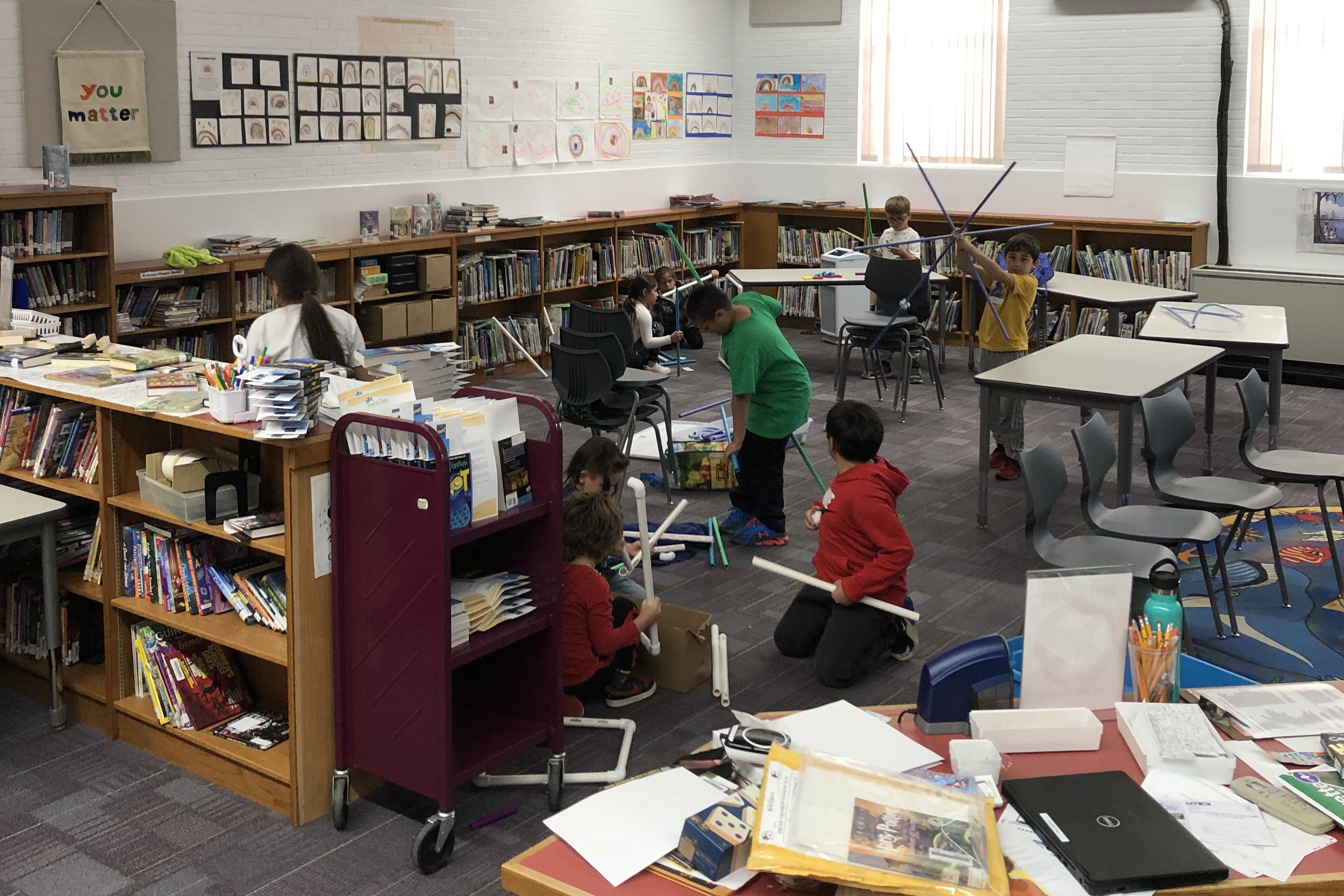 students working on building project in library